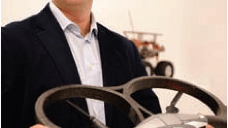 Professor Jon Timmis with a flying
drone robot