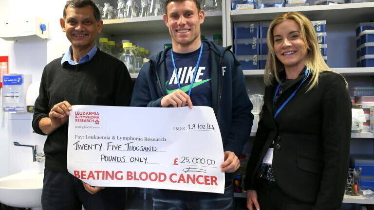 Footballer visits childhood cancer research project