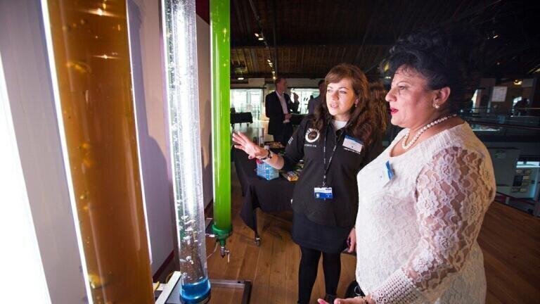 •	Image 119 - Alla Silkina of Swansea University demonstrates algal cultivation techniques to Mariana Gaju of the Committee of the Regions.