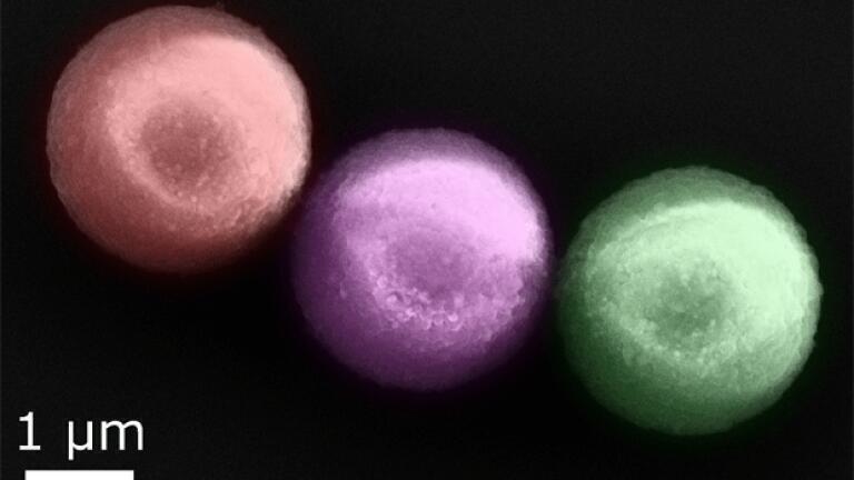 A close-up of three magnetic particles (false colour)