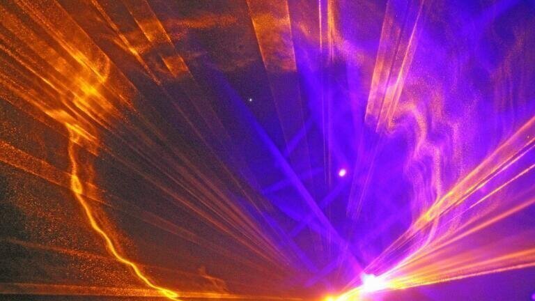 Could Lasers Hide the World from Aliens?