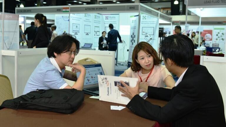 Exhibitors meeting with potential clients through the One2One Business Matching Programme.
