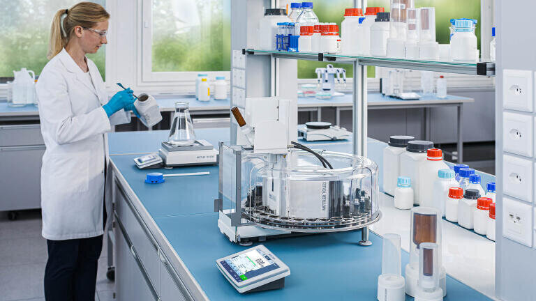 Addition of a sample changer to the XPR Automatic (foreground) can enable the fully automated handling of up to 30 samples in an enclosed setting, allowing lab operators to focus on other value-added tasks. 