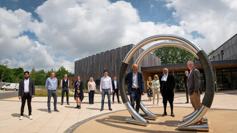 . Outside entrance to the Wood Centre for Innovation: Central: Jeremy Long (Chair, OxLEP); Imam Monawar Hussain (High Sheriff of Oxfordshire); Steve Burgess (CEO, The Oxford Trust). With representatives from The Oxford Trust, Oxford Innovation, Oxfordshire Local Enterprise Partnership, DJS Antibodies and Samsara Therapeutics.