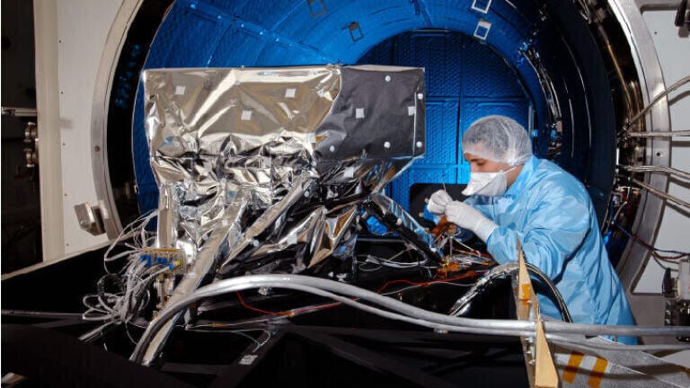 RAL Space Chief Engineer Paul Eccleston working on MIRI (Credit: STFC)