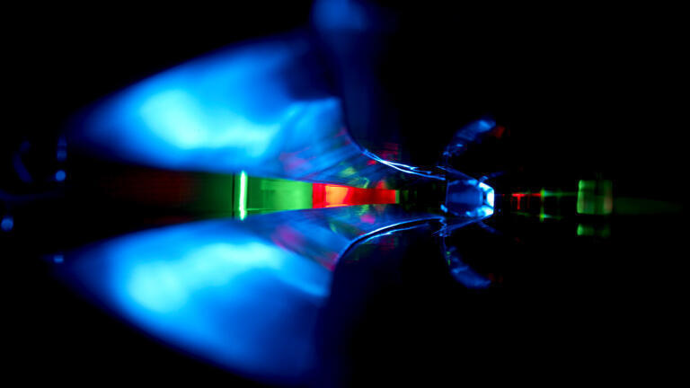 Inside a vacuum pipe, where electrons travel at nearly the speed of light, painted with light. Proving that science can be beautiful.