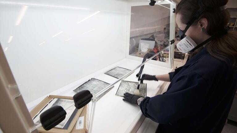 Monmouth Scientific’s Recirculating Fume Cupboard is used by National Collection of Aerial Photography staff as mould is safely removed from photographic prints before a digital replication is created.