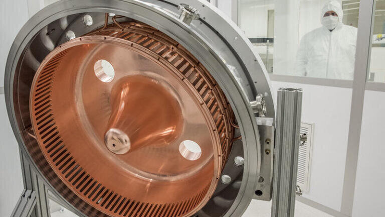 The Electron Gun knocks electrons out of atoms with a laser beam so they can be accelerated to nearly the speed of light for experiments that explore nature’s fastest atomic processes. This copper cone structure is inside the injector gun’s central cavity. (Marilyn Chung/Lawrence Berkeley National Laboratory)
