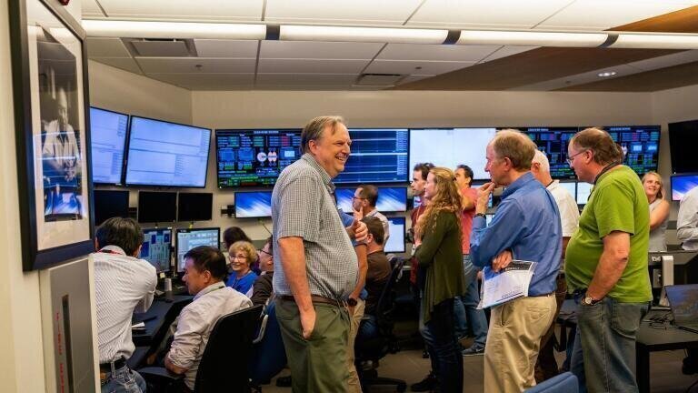 Cheerful atmosphere at SLAC's Accelerator Control Room, May 29, 2019: The electron gun that will drive X-ray production by LCLS-II, the lab's next-gen X-ray laser, fired its first electrons. (Credit: Farrin Abbott/SLAC National Accelerator Laboratory)
