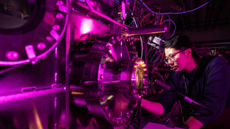 Staff scientist Meng Liang, seen by the Coherent X-ray Imaging instrument, located at the LCLS Far Experimental Hall. (Jacqueline Ramseyer Orrell/SLAC National Accelerator Laboratory)