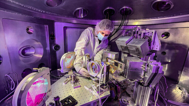 Project scientist Chandra Curry, seen with the Matter in Extreme Conditions instrument located in the LCLS Far Experimental Hall. (Jacqueline Ramseyer Orrell/SLAC National Accelerator Laboratory)