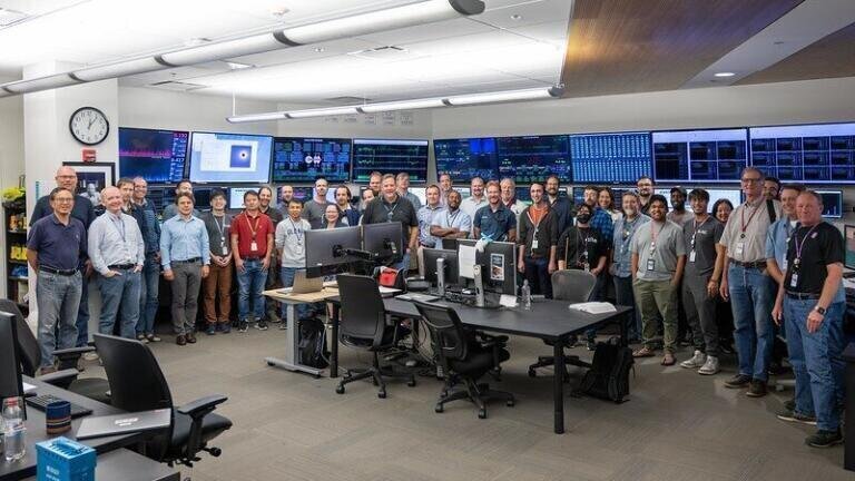 Folks from the LCLS-II commissioning team gathered in the accelerator control room to celebrate first light through the LCLS-II accelerator. (Matt Boyes/SLAC National Accelerator Laboratory)