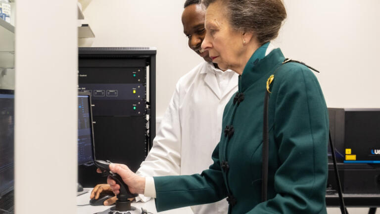 Her Royal Highness looking at fruit flies with post doctoral researcher Claudia Lennicke. (Credit: Paul Clarke Photography)