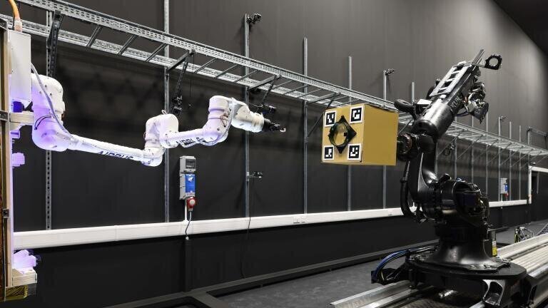 Robot tracking equipment with a target satellite and the Airbus VISPA robotic arm (Credit: Airbus Defence and Space)