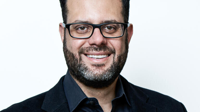 John E. Milad