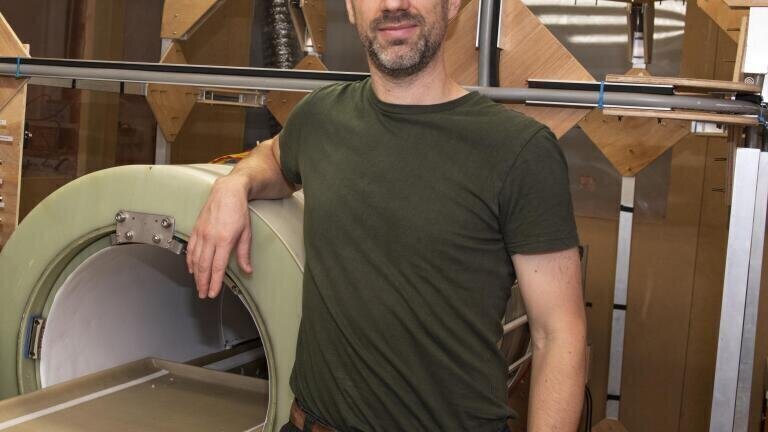Dr Lionel Broche with the prototype FCI scanner. Photo Credit University of Aberdeen