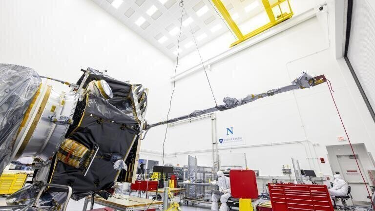 The magnetometer (MAG) boom is shown in the deployed position extending out from the Interstellar Mapping and Acceleration Probe (IMAP) at the Johns Hopkins Applied Physics Laboratory in Laurel, Maryland. Image Credit: NASA/Johns Hopkins/Princeton/Ed Whitman