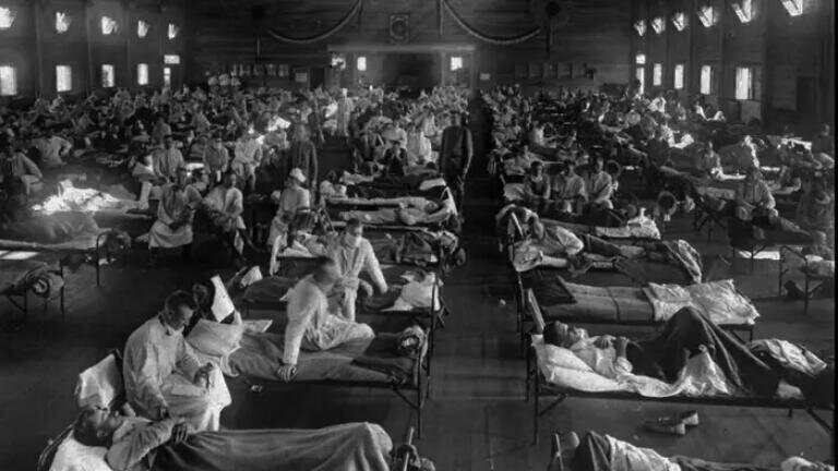 Influenza victims crowded into an emergency hospital near Fort Riley, Kansas in 1918. Credit: AP Photo National Museum of Health