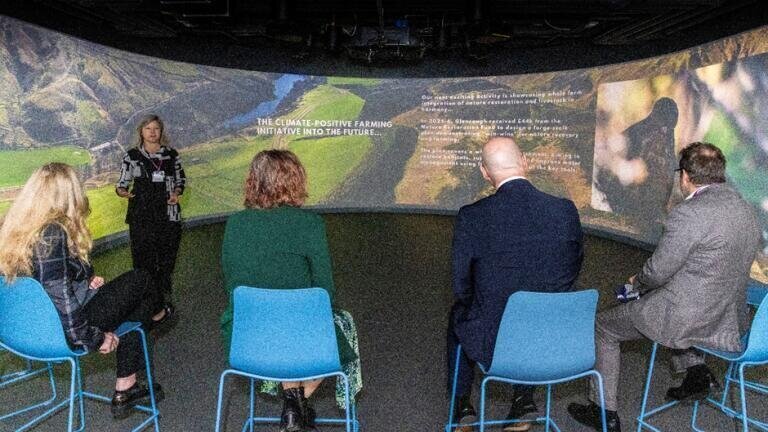 Professor Alison Hester presenting in the Immersive Suite in front of (L-R) Cabinet Secretary for Climate Action and Energy Gillian Martin, Professor Lee-Ann Sutherland, First Minister John Swinney and Professor Colin Campbell. Credit: The James Hutton Institute
